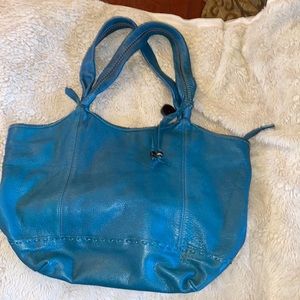 Green with tan brown stitching The Sak handbag